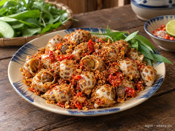 Ốc hương rang muối ớt (ảnh minh hoạ do AI tạo)