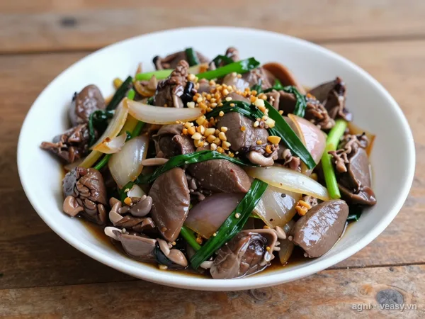 Tim gà xào hành (ảnh minh hoạ do AI tạo)